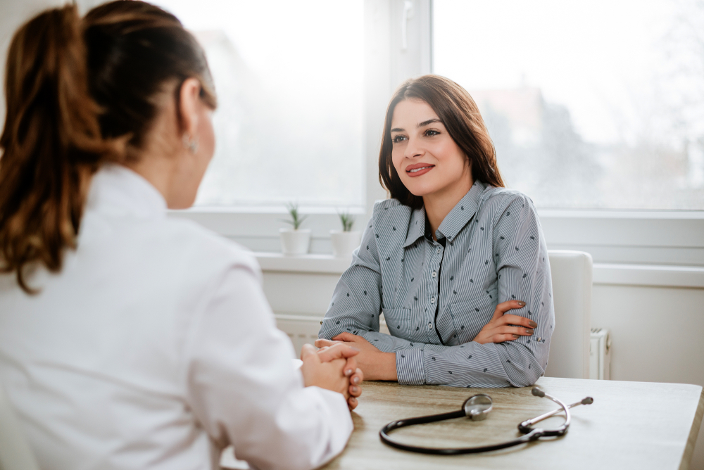Beautiful young brunette woman at doctors office