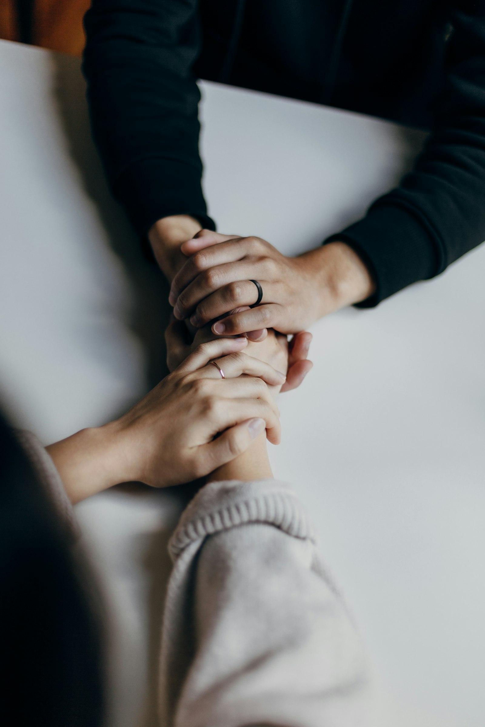 Hands held together in support